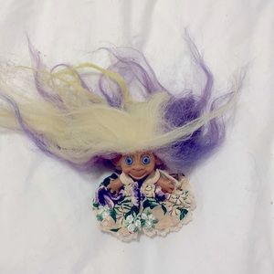 Vintage troll doll with purple flower dress